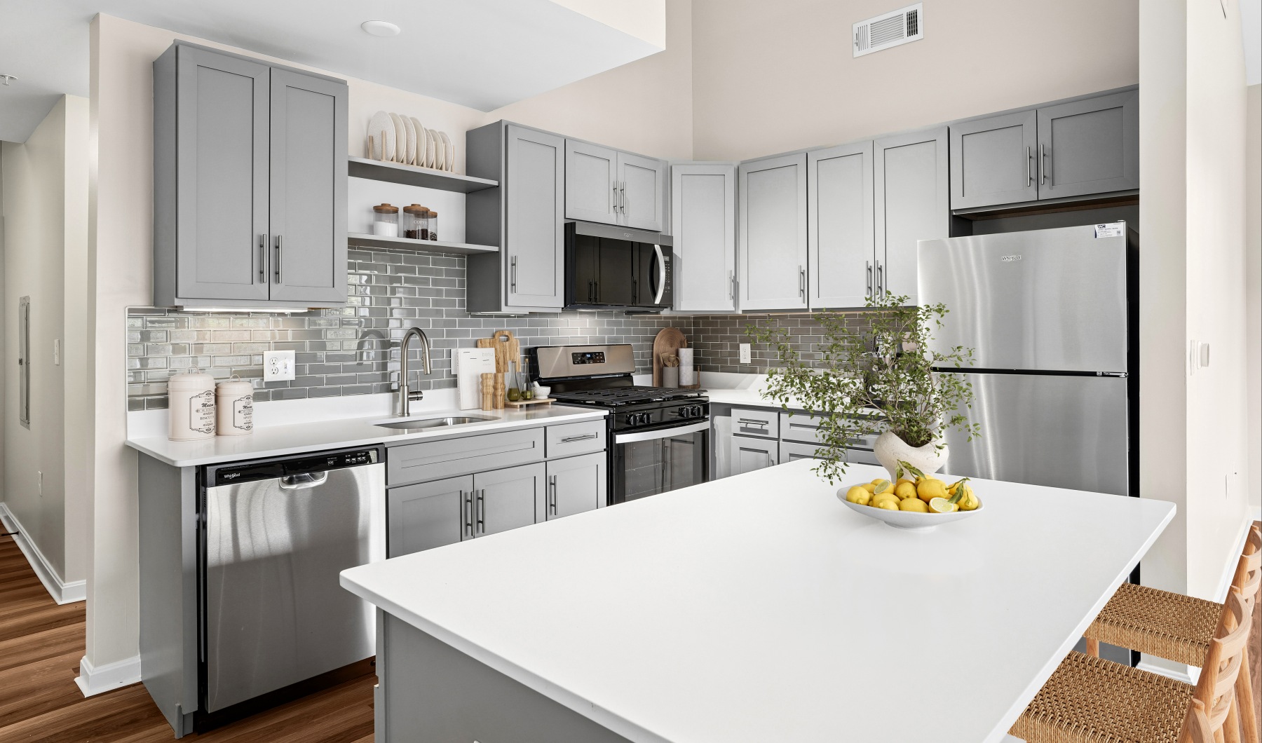 Open kitchen and living room with plenty of natural light.